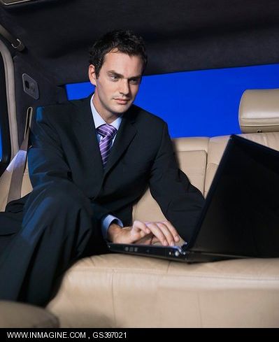 man-in-car-with-laptop